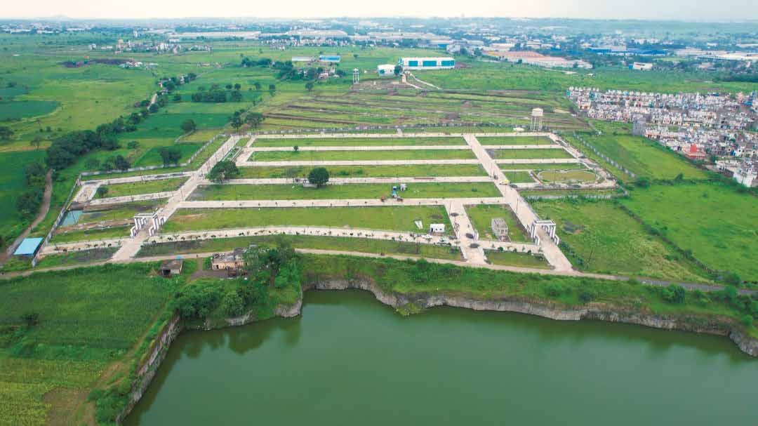 Aerial view of a lakefront township on the Pithampur–Mhow corridor